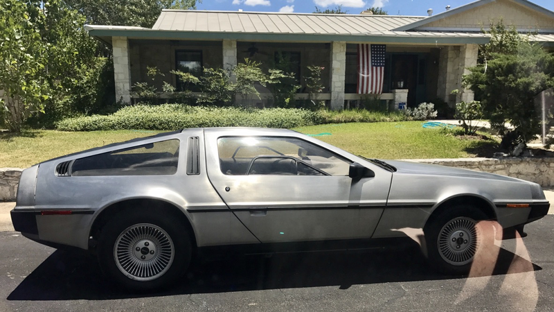 DeLorean DOTS in my neighborhood. I love the flag in the background. I wish I had rolled down my window to get rid of the reflections.